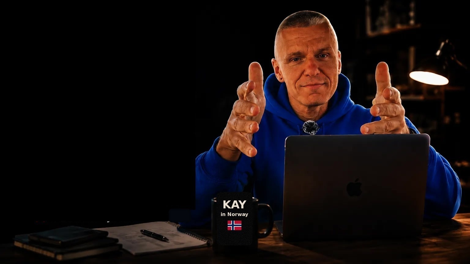 Kay in Norway at the desk, mug branded Kay in Norway